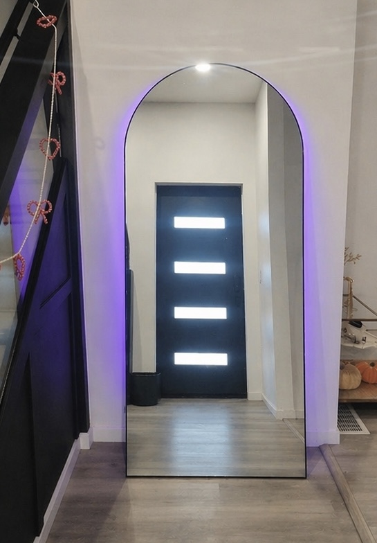 Empty entryway with only an arched mirror before design