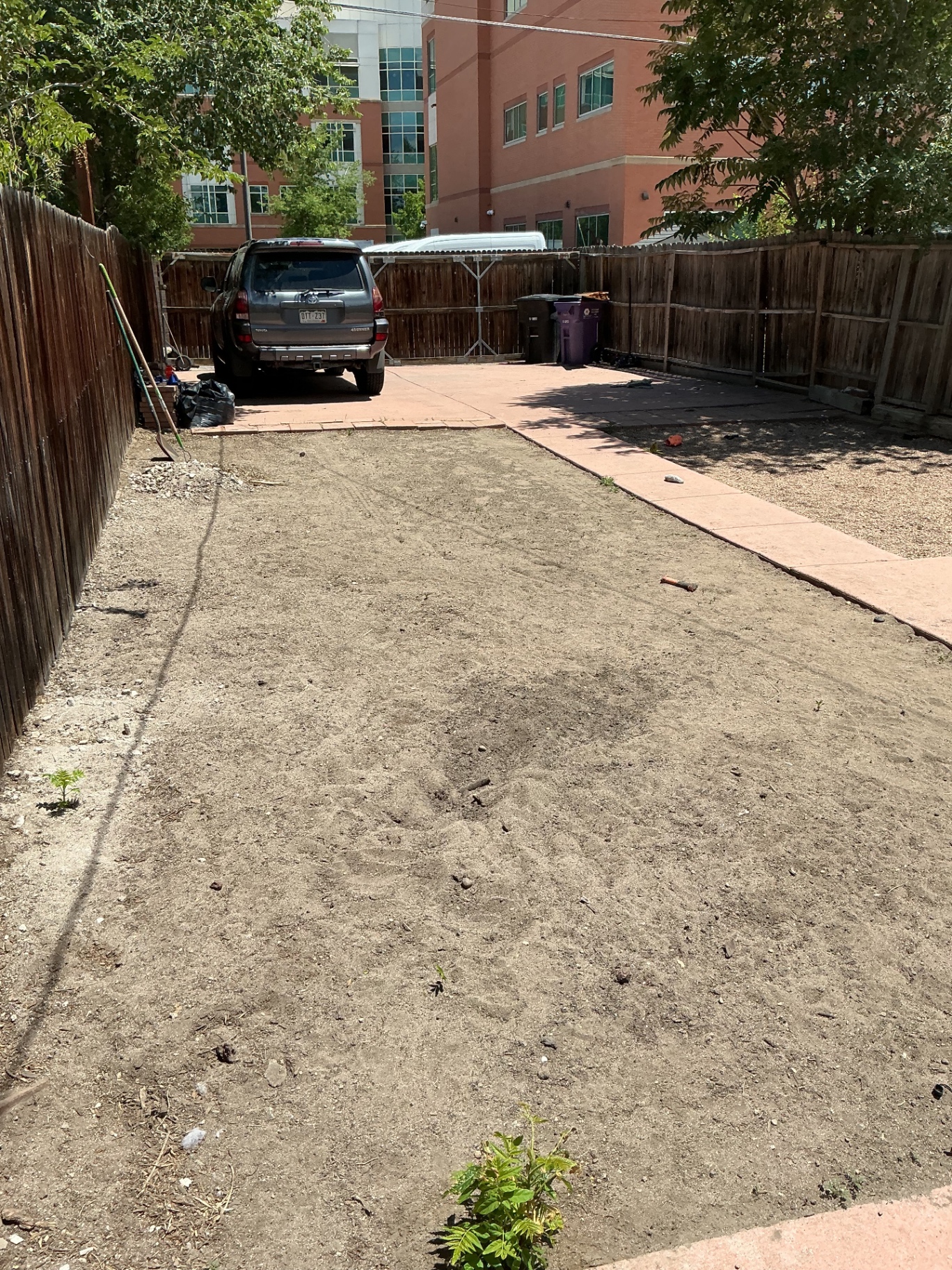 Empty dirt backyard before outdoor design